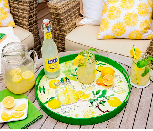 lemon themed tray illustrated in watercolor on a table with fresh lemonade and glass