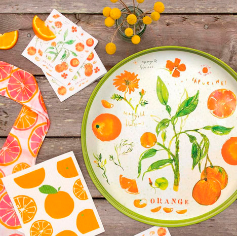 orange tree themed tray on a table with party stuff

